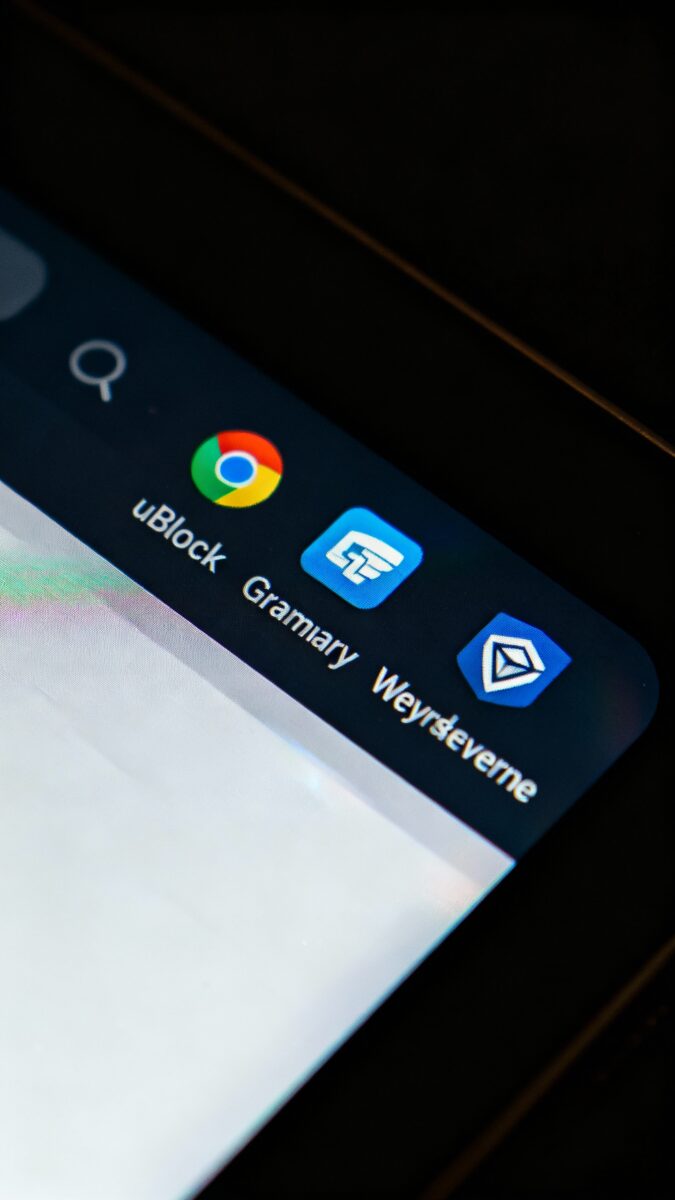 Closeup of Chrome toolbar with uBlock, Grammarly, Keywords Everywhere icons, dark mode, reflective s